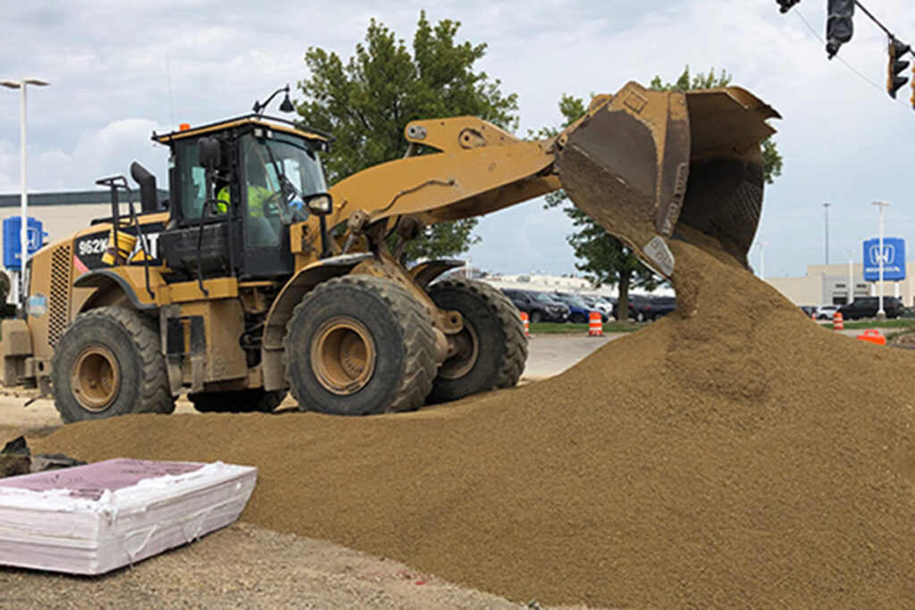 Sand being dumped at job site